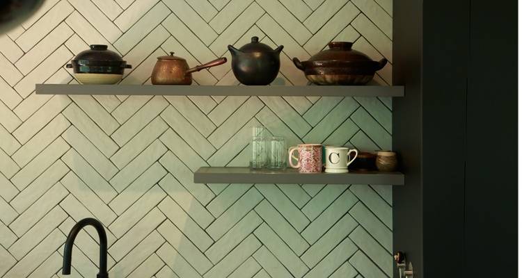 green herringbone tiles in kitchen