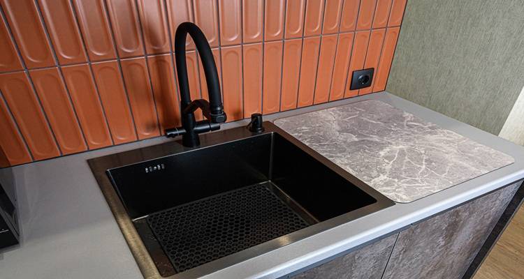 orange matt tiles black tap