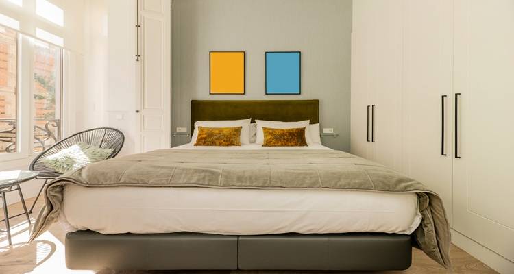 yellow blue frames above bed