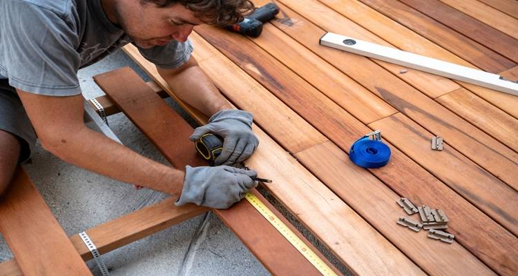 man laying decking