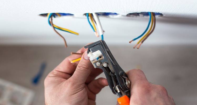 wires hanging out of ceiling
