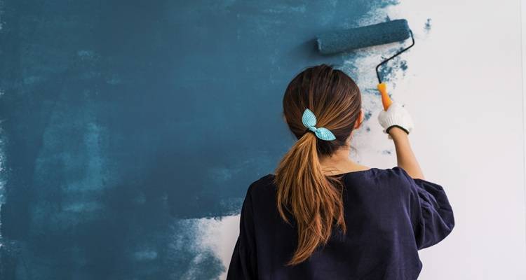woman painting walls