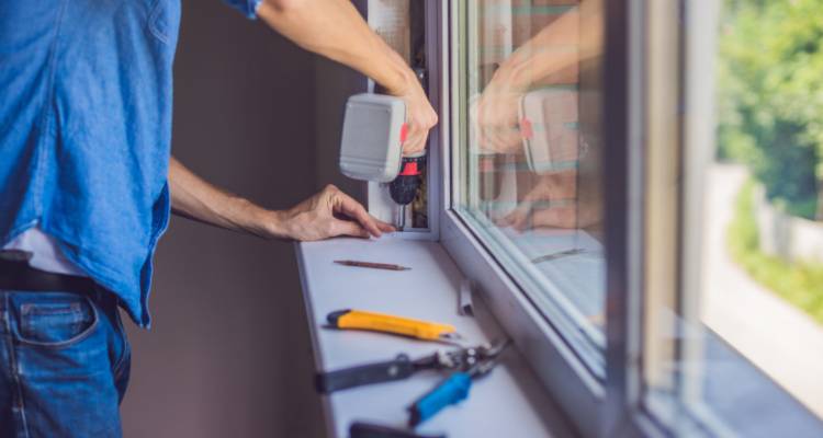 person installing windowsill