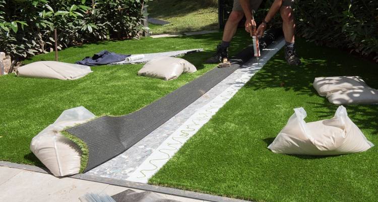 fake grass laid grey ground