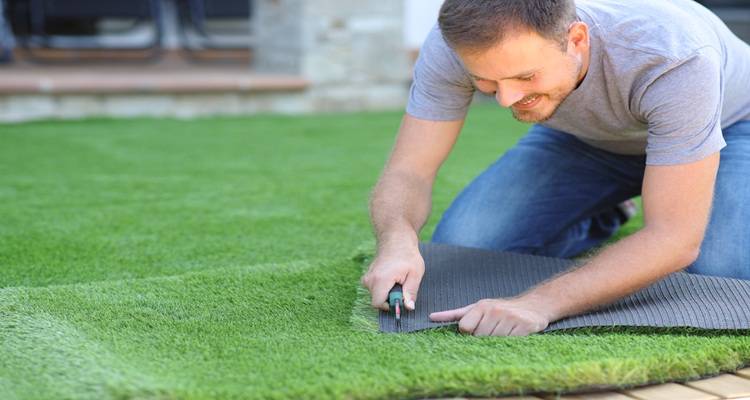 man laying fake turf t shirt