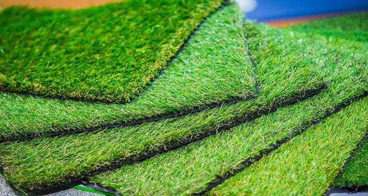 four pieces of grass on top of one another