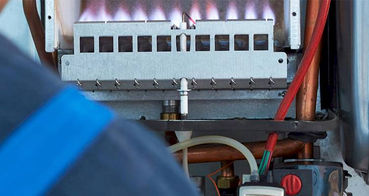 closeup of the internal components of an active boiler