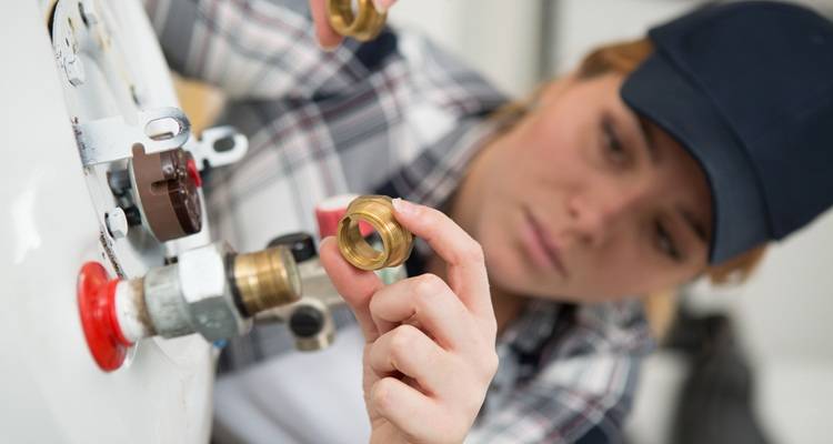 blurred woman fixing boiler