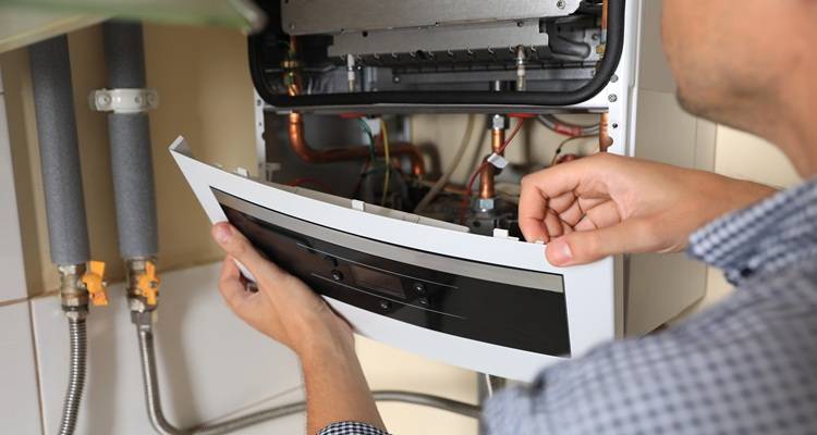 man opening boiler