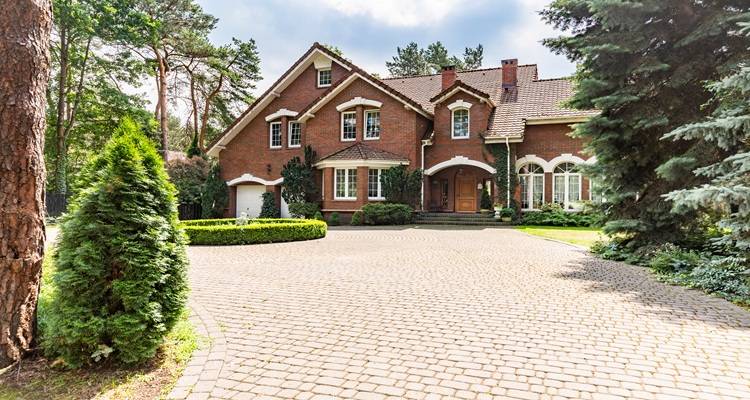 big brick driveway and house