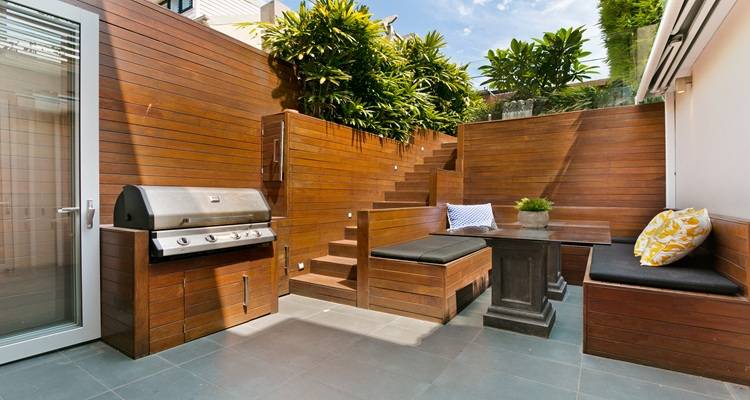 wooden outdoor kitchen blue skies