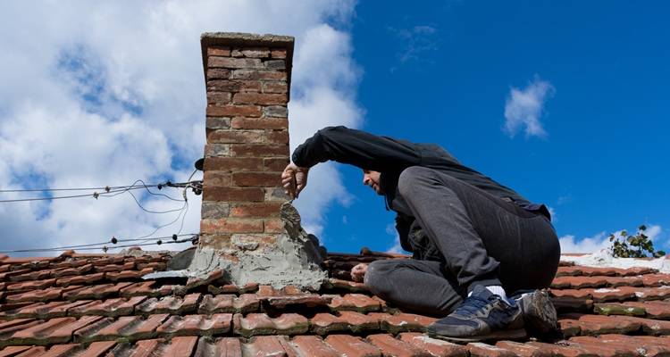 old chimney stack being repaired