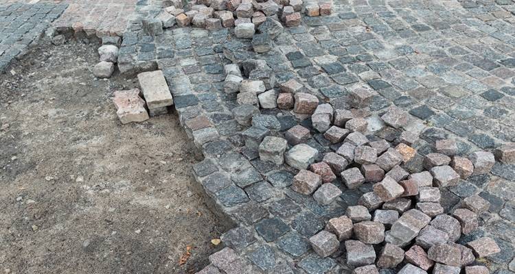 half laid cobblestone drive