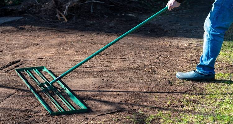 lawn leveller person on ground