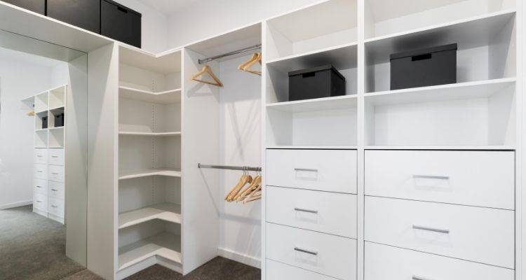 wardrobes that have been custom fit for a walk-in wardrobe