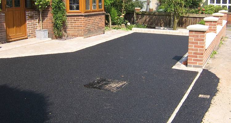 basic tarmac driveway installation on front of a UK property
