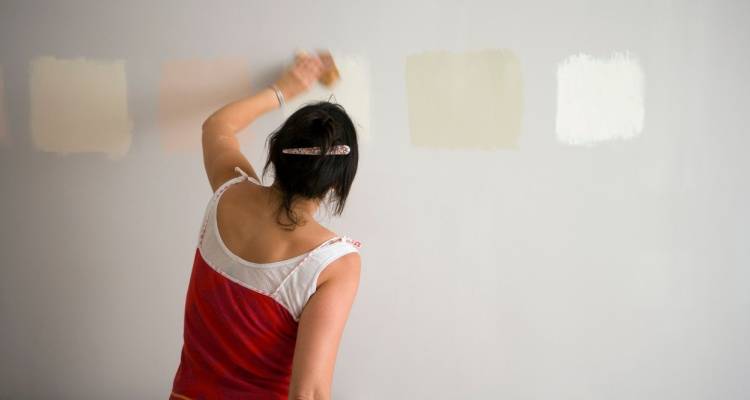 woman painting wall