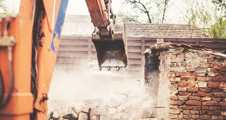 Tradesperson removing wall