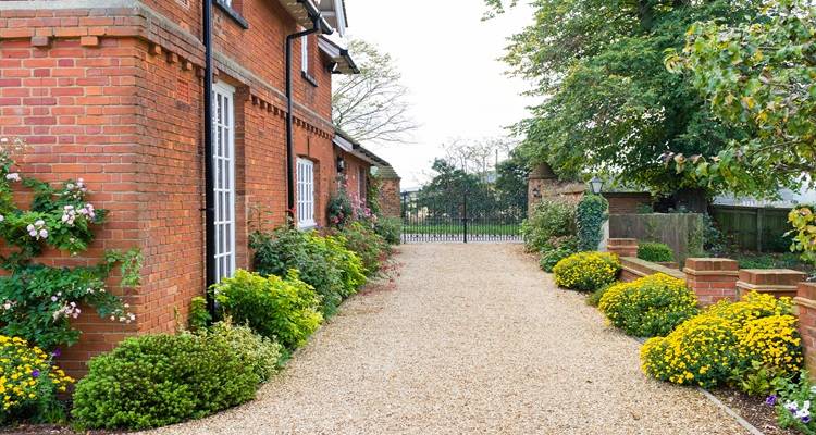 long resin driveway red brick house