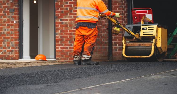 tarmac drive roller orange man