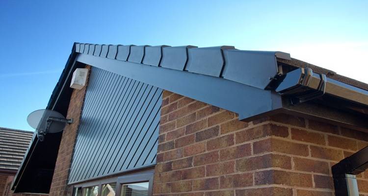 dry verge dark grey house