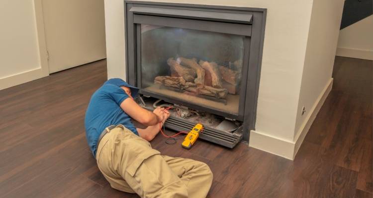 person repairing electric fireplace