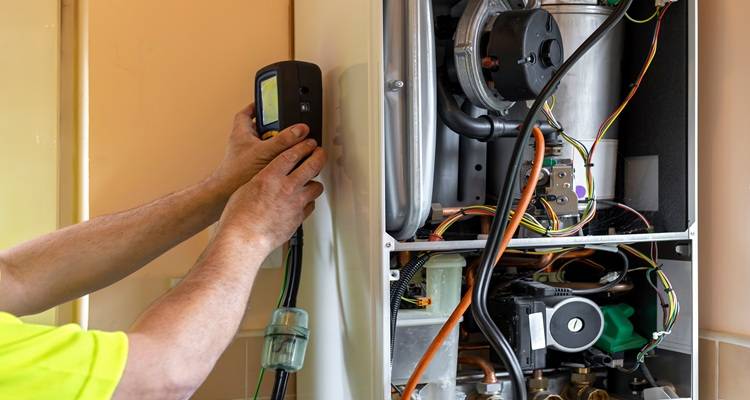 man testing boiler