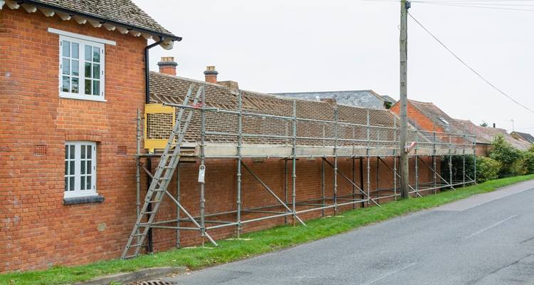 scaffolding along red brick barn road