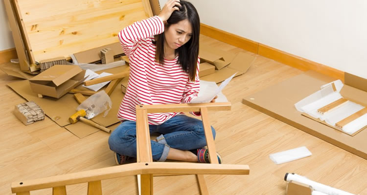 woman building flat pack chair