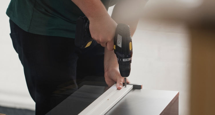 handyman drilling flat pack drawers
