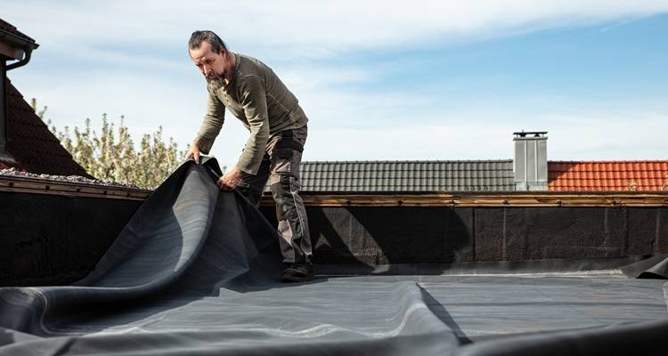man rubber sheeting roof