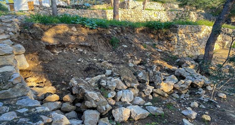 damaged garden wall cobbles