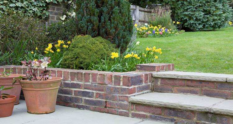 brick garden wall plant pots