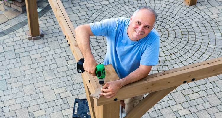 man drilling gazebo