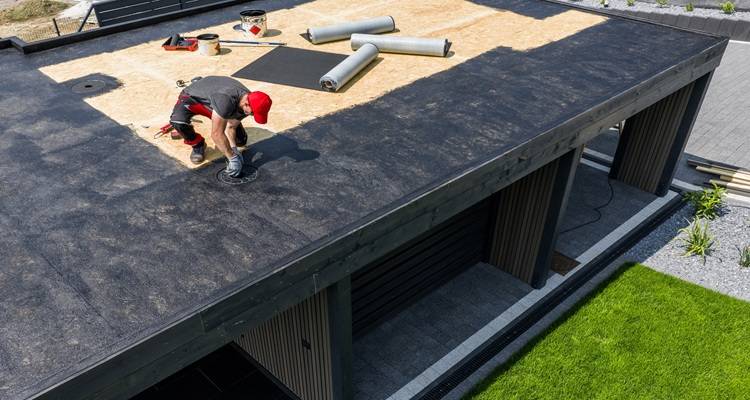 epdm roof man in red