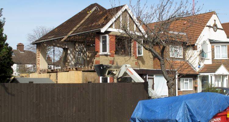 house extension cost guide &mdash; a large extension in the process of being added to a UK property