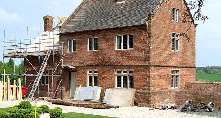 house extension cost guide &mdash; building project being conducted on a UK property