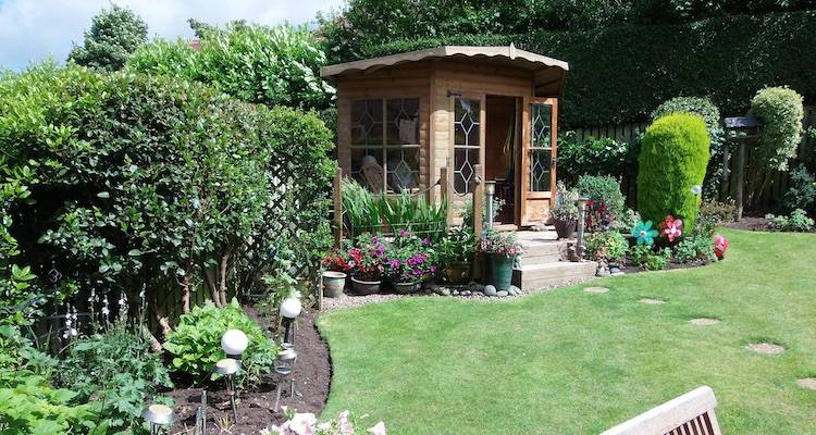 house extension cost guide &mdash; summer house in a UK garden