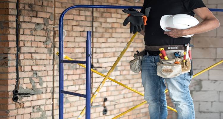 orange ladder man chased out wall