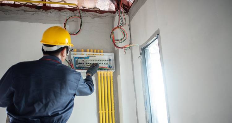 man working on consumer unit