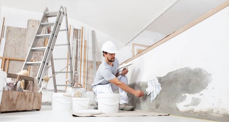 man bending plastering