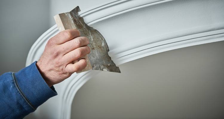 plasterer making mouldings
