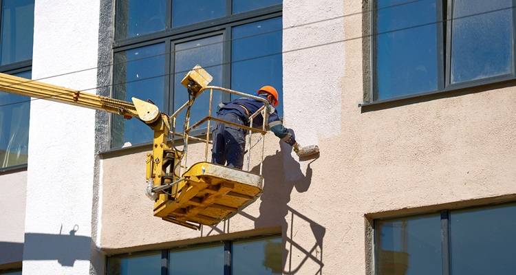painters in a cherry picker