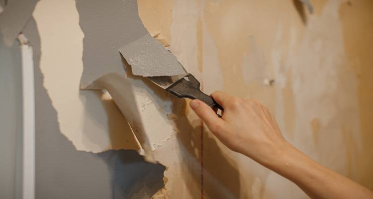 hand scraping wallpaper