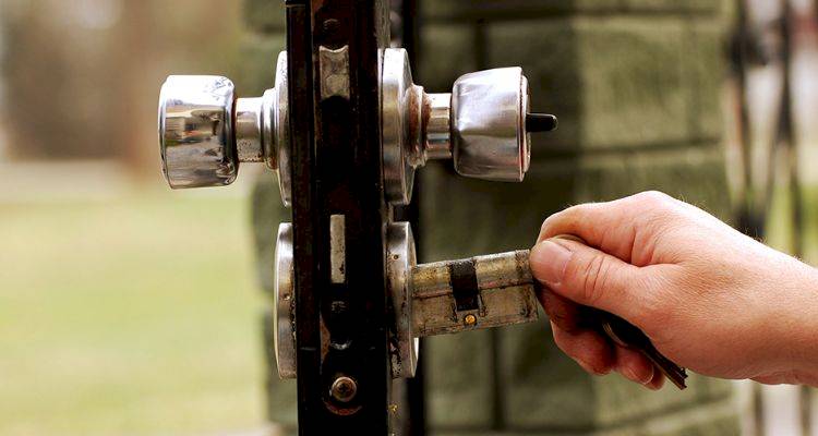 closeup of locks being changed on a door