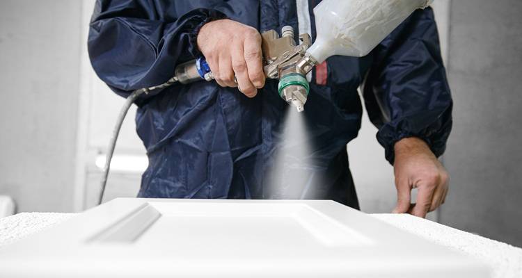 cupboard door being sprayed