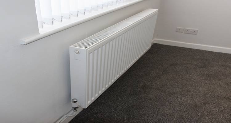 new radiator that has been installed by a tradesperson instead of painting