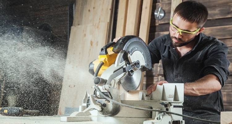 carpenter sawing wood