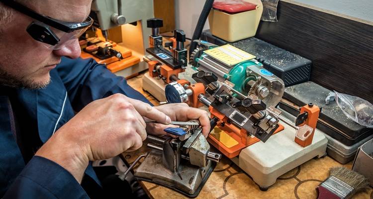 man cutting keys