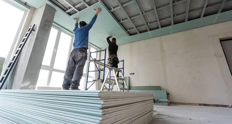 man boarding ceiling